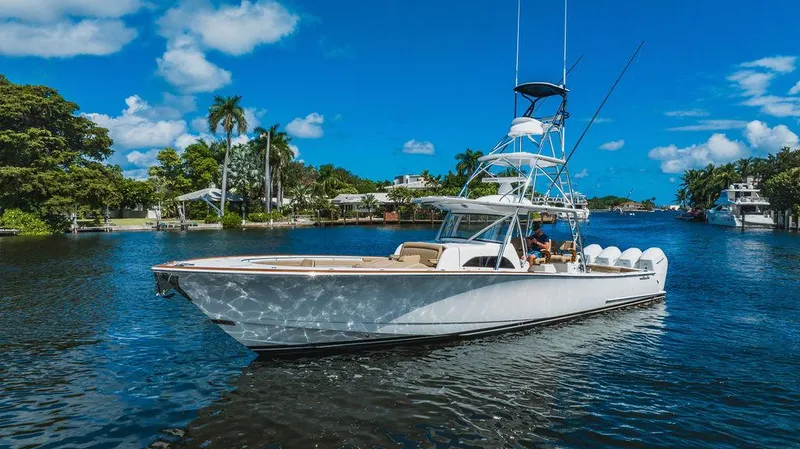 Slide: The Image of 2023 Valhalla Boatworks V-46 cruising on a sunny day in a scenic waterway. - 10