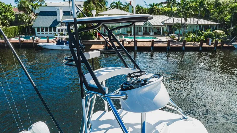Slide: The Image of 2023 Valhalla Boatworks V-46 helm with waterfront view, showcasing sleek design and modern features. - 11