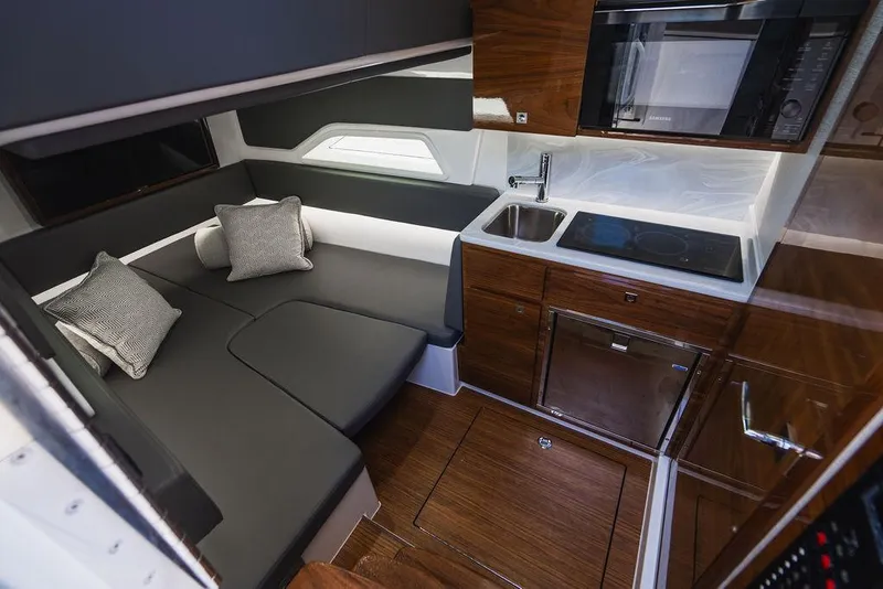 Slide: The Image of Luxurious interior of 2023 Valhalla Boatworks V-46 with modern kitchen and seating area. - 13