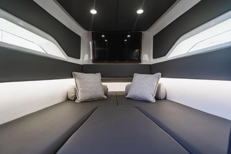 Slide: The Image of Luxurious interior of 2023 Valhalla V-46 boat with cushions and TV. - 14