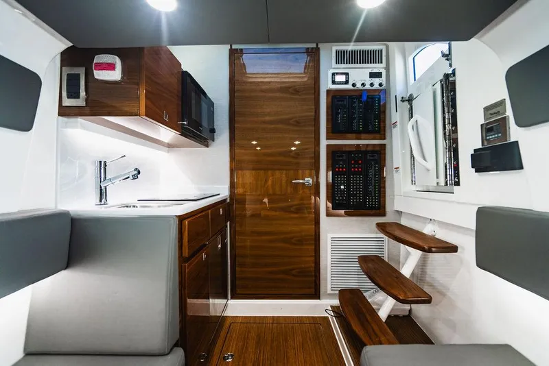 Slide: The Image of Modern interior of 2023 Valhalla Boatworks V-46, featuring wood accents and sleek design. - 15