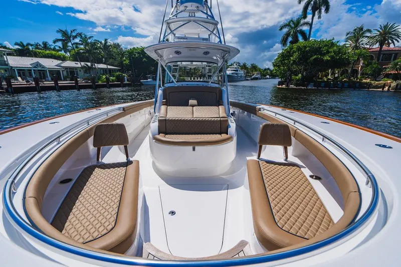 Slide: The Image of 2023 Valhalla Boatworks V-46 luxury boat with spacious seating on a sunny day. - 25