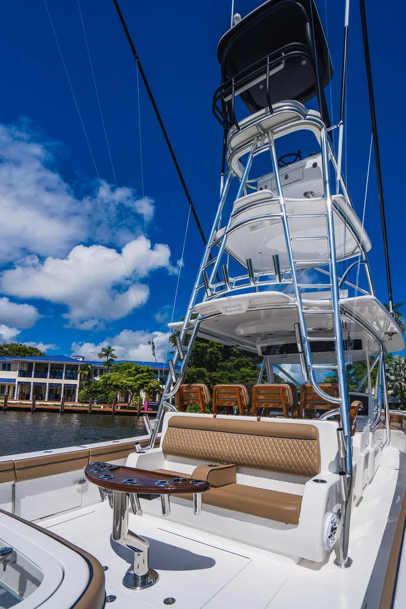 Slide: The Image of 2023 Valhalla Boatworks V-46 with tower, docked under clear blue sky. - 34