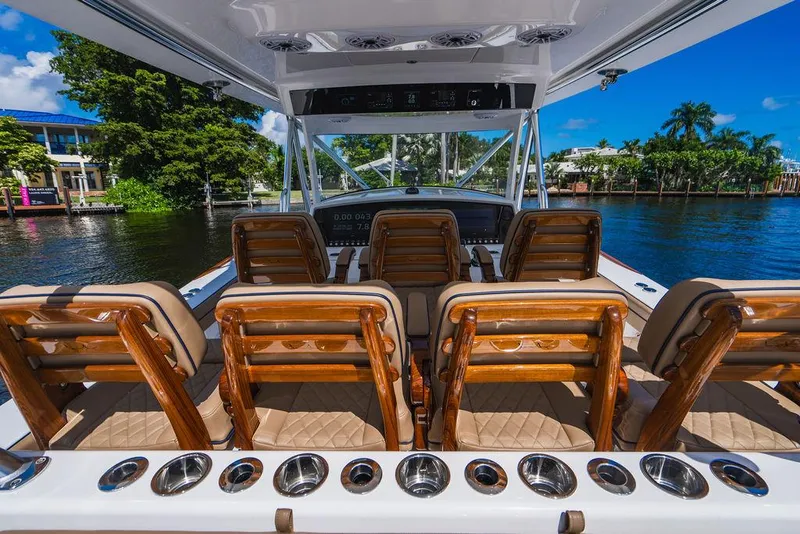 Slide: The Image of 2023 Valhalla Boatworks V-46 interior with luxurious seating and scenic waterfront view. - 38