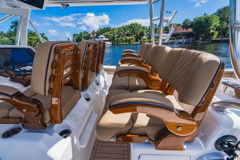Slide: The Image of 2023 Valhalla Boatworks V-46 interior with luxurious seating and scenic waterfront view. - 42
