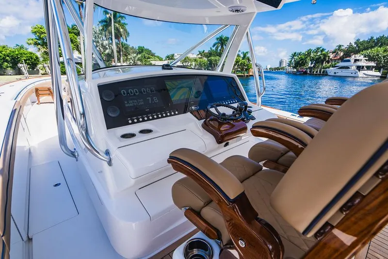 Slide: The Image of 2023 Valhalla Boatworks V-46 helm with advanced navigation system and luxurious seating. - 43