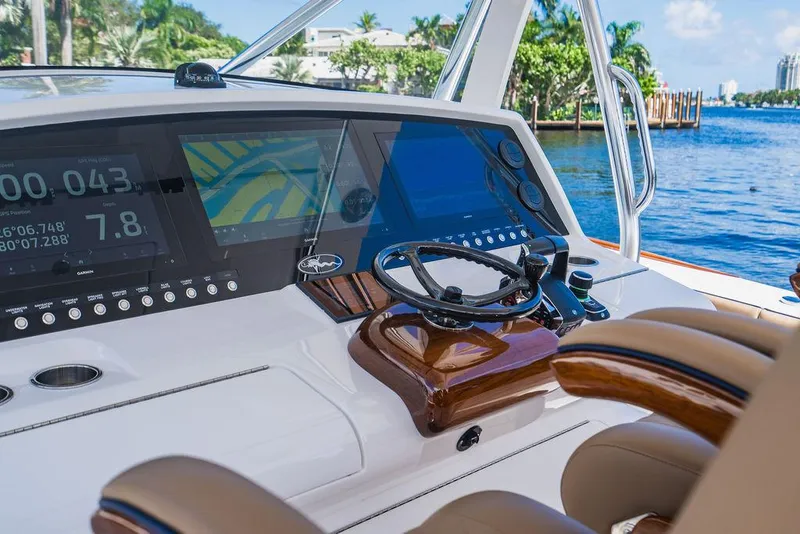 Slide: The Image of 2023 Valhalla V-46 boat helm with advanced navigation displays and luxurious seating. - 44