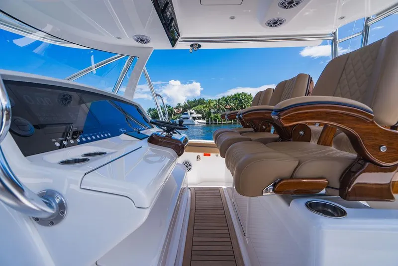 Slide: The Image of 2023 Valhalla Boatworks V-46 interior with luxurious seating and modern dashboard. - 45