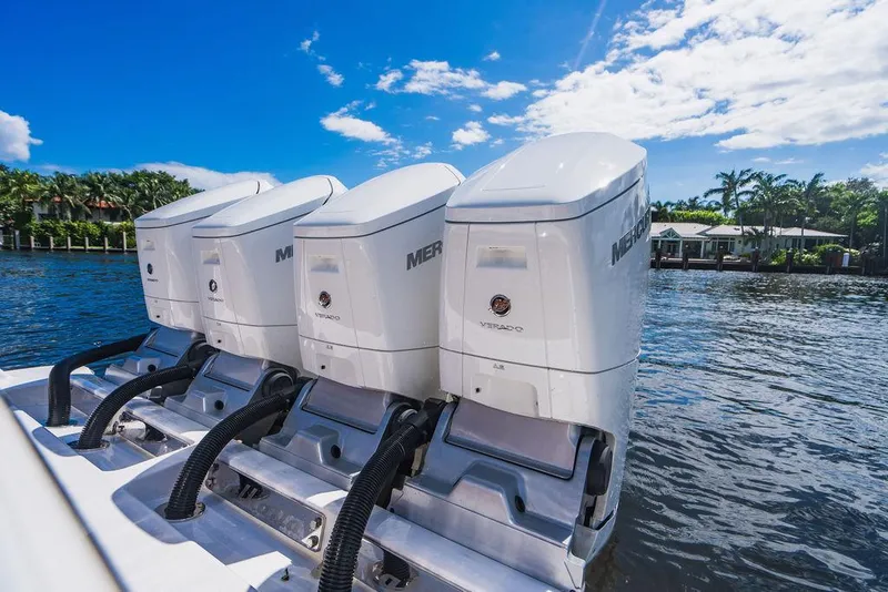 Slide: The Image of 2023 Valhalla Boatworks V-46 with four powerful outboard engines on a sunny day. - 48
