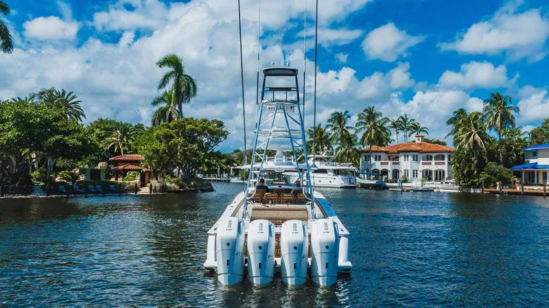 Slide: The Image of 2023 Valhalla Boatworks V-46 cruising in a scenic, tropical waterway. - 6