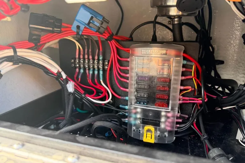 Slide: The Image of Electrical wiring and fuse box in a 2014 East Cape Vantage VHP boat. - 13