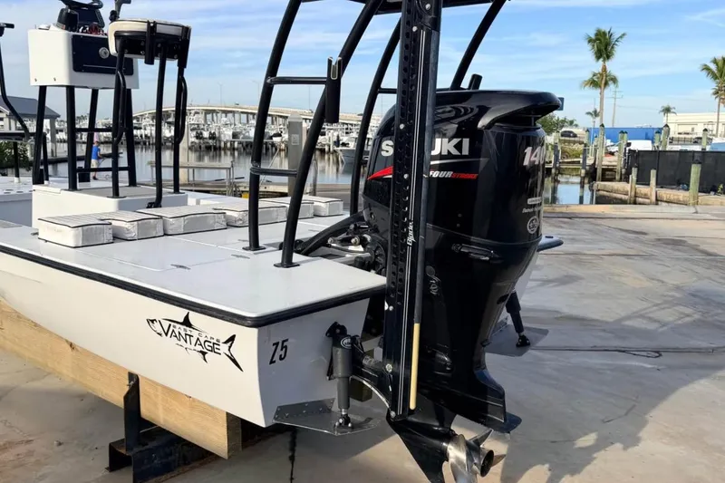 Slide: The Image of 2014 East Cape Vantage VHP boat with Suzuki 140 outboard motor at marina. - 5