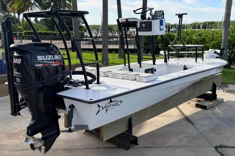 Slide: The Image of 2014 East Cape Vantage VHP boat with Suzuki 140 outboard motor, docked outdoors. - 7