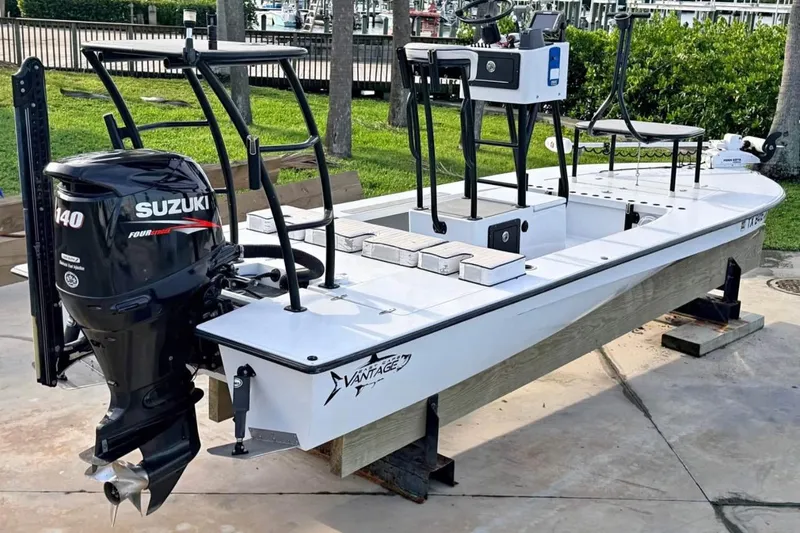 Slide: The Image of 2014 East Cape Vantage VHP boat with Suzuki 140 outboard motor on display. - 9