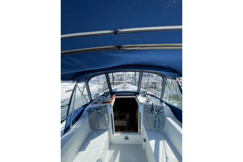 Slide: The Image of Interior view of a 1999 Catalina 36 MkII sailboat cockpit with blue canopy. - 15