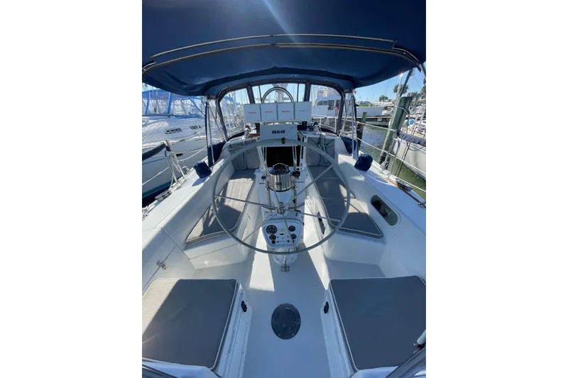Slide: The Image of 1999 Catalina 36 MkII sailboat cockpit with steering wheel and navigation equipment. - 17