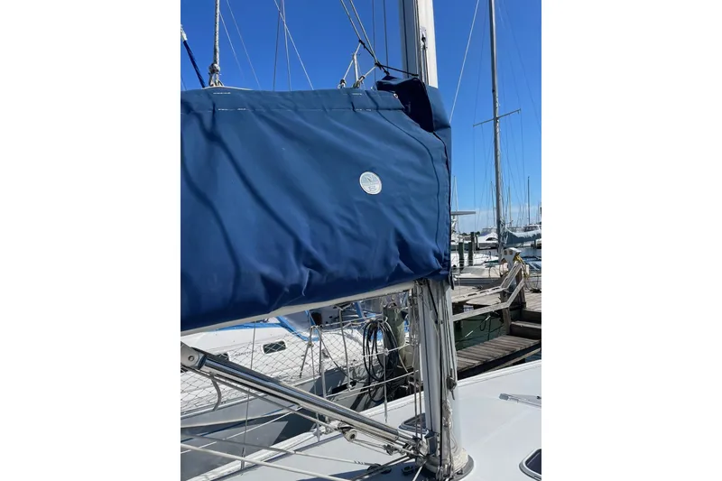Slide: The Image of Blue sail cover on 1999 Catalina 36 MkII sailboat at marina. - 19