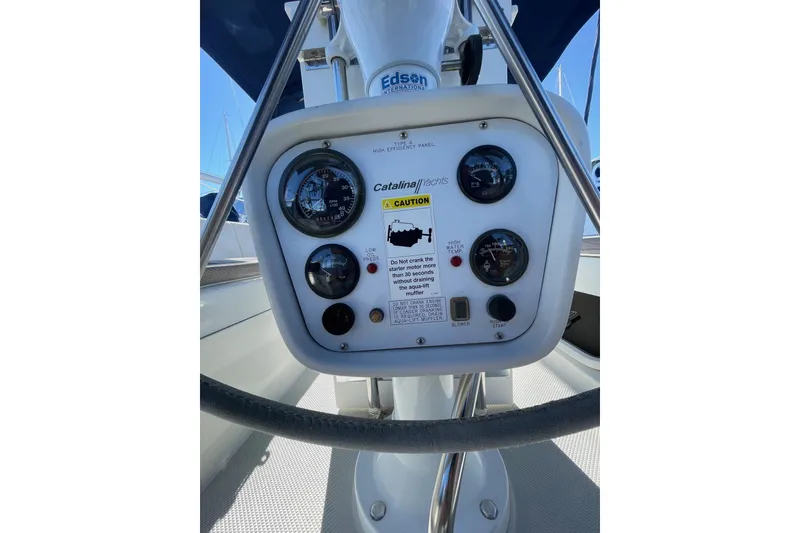 Slide: The Image of Control panel of a 1999 Catalina 36 MkII sailboat with gauges and caution label. - 20
