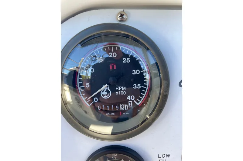 Slide: The Image of Tachometer of 1999 Catalina 36 MkII sailboat showing RPM and engine hours. - 21