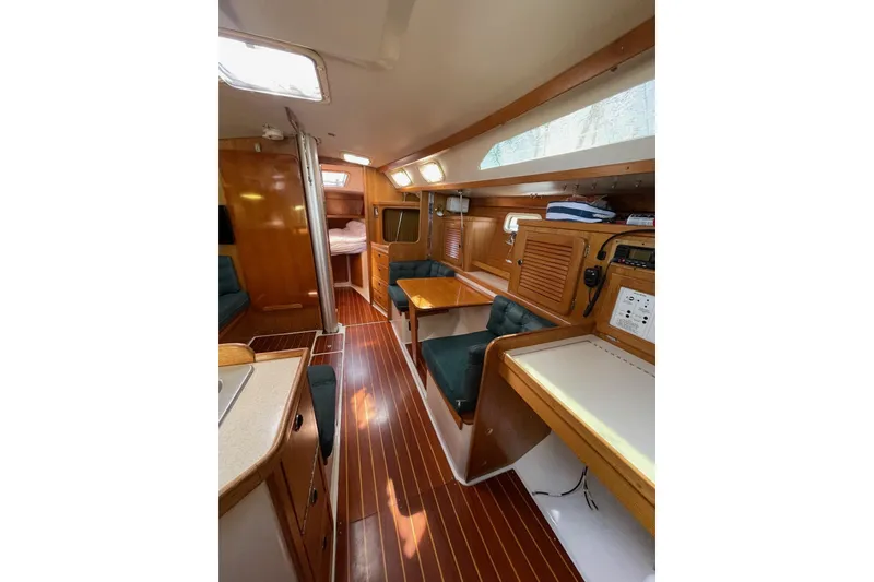 Slide: The Image of Interior of 1999 Catalina 36 MkII sailboat with wood finish and seating area. - 24