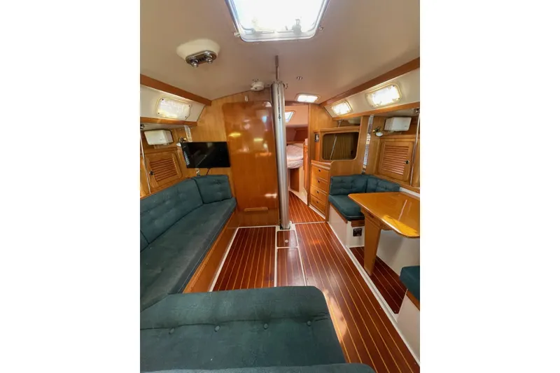 Slide: The Image of Interior of 1999 Catalina 36 MkII sailboat with wood finish and seating area. - 25
