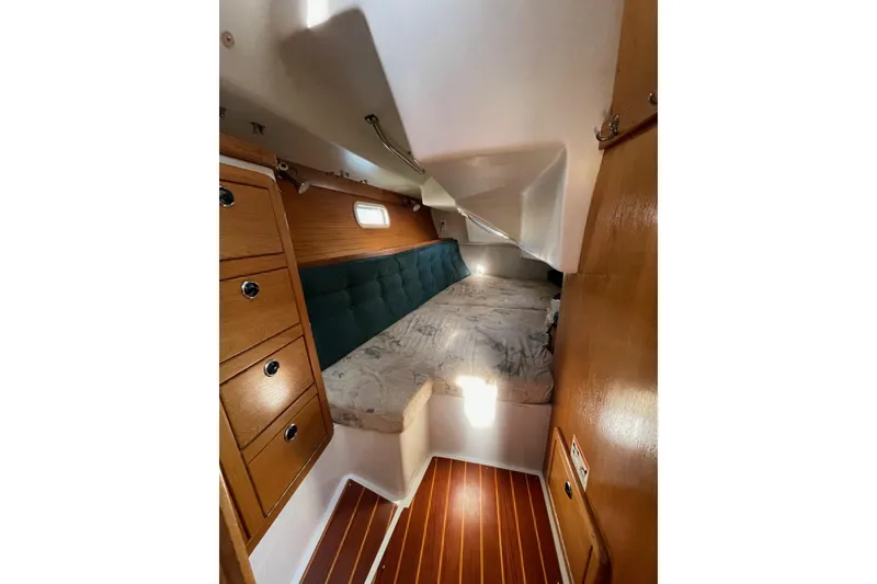 Slide: The Image of Cozy cabin interior of 1999 Catalina 36 MkII sailboat with wooden cabinetry and bed. - 28