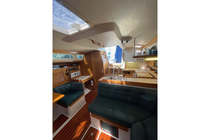 Slide: The Image of Interior of 1999 Catalina 36 MkII sailboat with cozy seating and wooden finishes. - 31