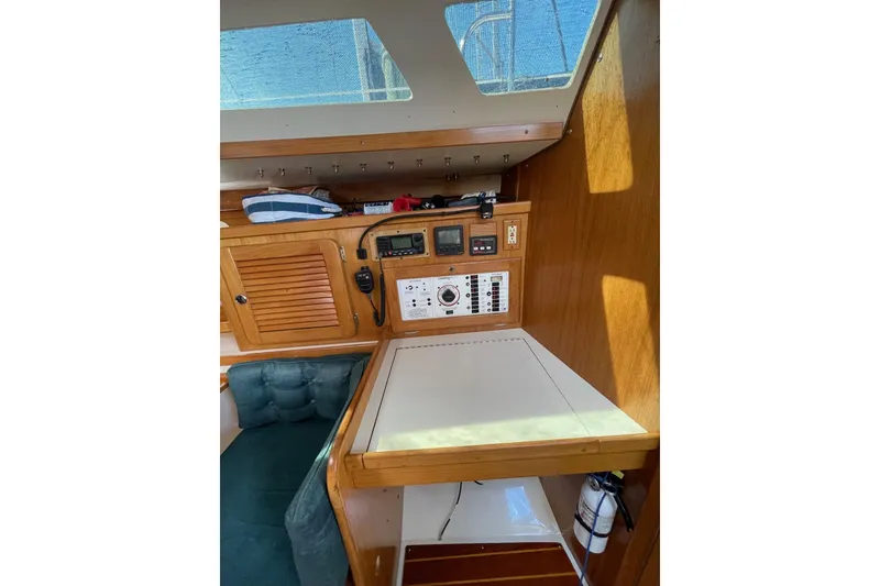 Slide: The Image of 1999 Catalina 36 MkII yacht interior with navigation station and control panel. - 33