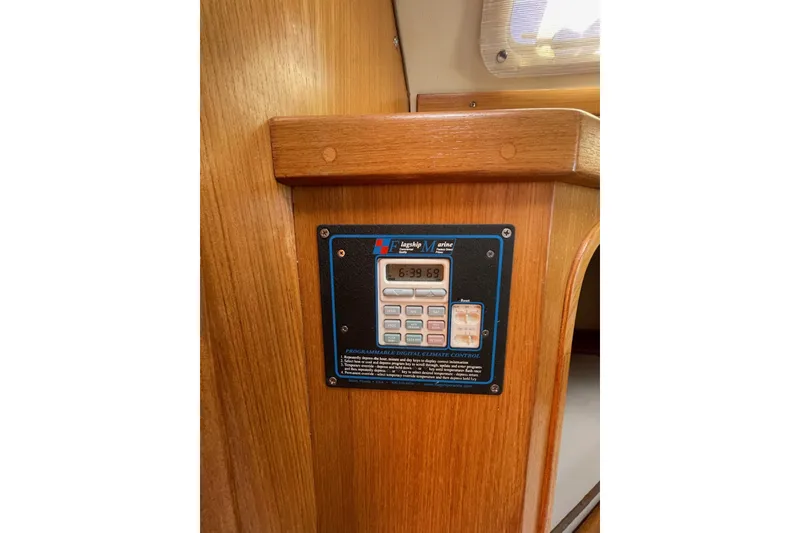 Slide: The Image of Digital control panel on 1999 Catalina 36 MkII yacht interior, mounted on wooden surface. - 35