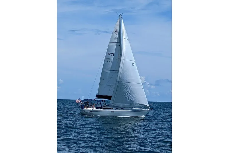 Slide: The Image of Sailing yacht Catalina 36 MkII 1999 on open sea under clear blue sky. - 5