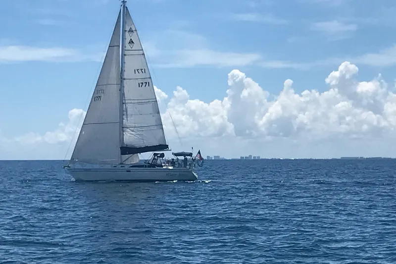 Slide: The Image of Sailboat Catalina 36 MkII 1999 cruising on open sea under clear skies. - 6