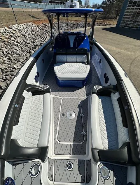 Slide: The Image of 2019 Mystic Powerboats M4200 with luxurious seating and sleek design. - 18