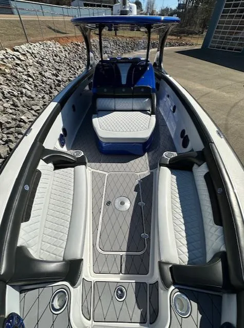 Slide: The Image of 2019 Mystic Powerboats M4200 with luxurious seating and sleek design. - 20