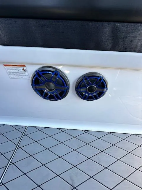 Slide: The Image of 2019 Mystic Powerboats M4200 speakers with blue accents on a patterned deck. - 28