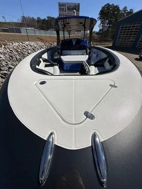 Slide: The Image of 2019 Mystic Powerboats M4200, sleek design, spacious deck, luxury seating, outdoor setting. - 3