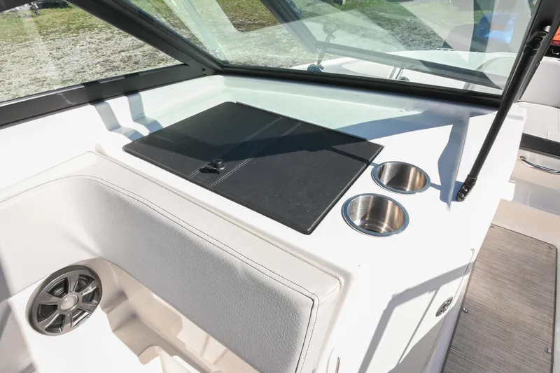 Slide: The Image of Interior view of 2021 Sea Ray SPX 210 boat with cup holders and seating. - 23