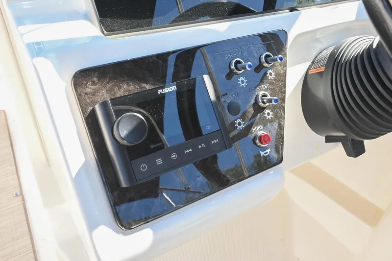 Slide: The Image of Control panel of 2021 Sea Ray SPX 210 boat with audio and lighting switches. - 27