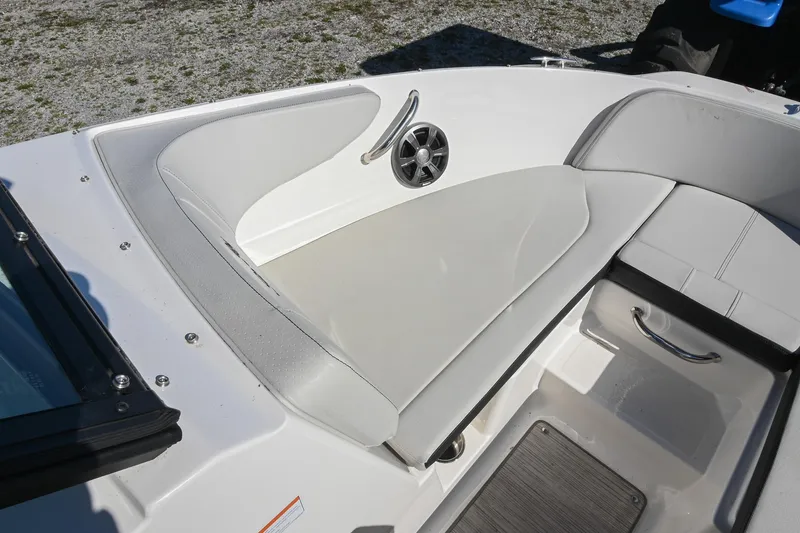 Slide: The Image of 2021 Sea Ray SPX 210 boat interior with white seating and speaker detail. - 31