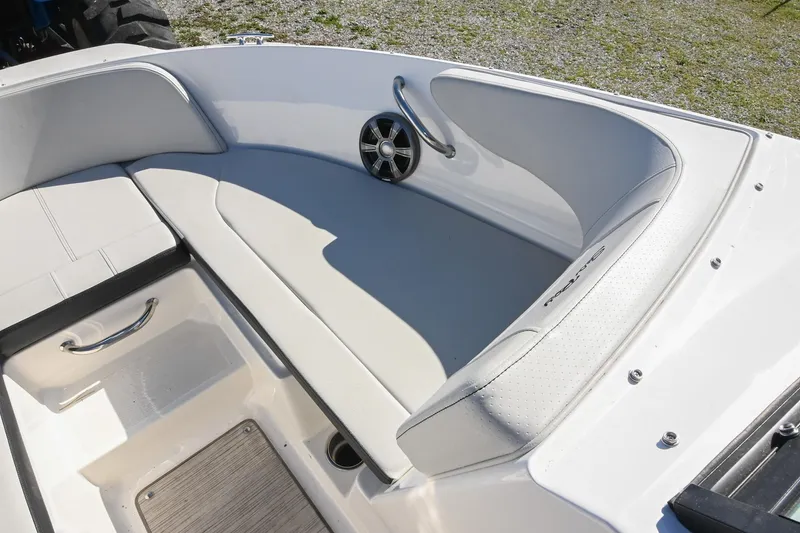 Slide: The Image of 2021 Sea Ray SPX 210 boat interior with white seating and speaker. - 33