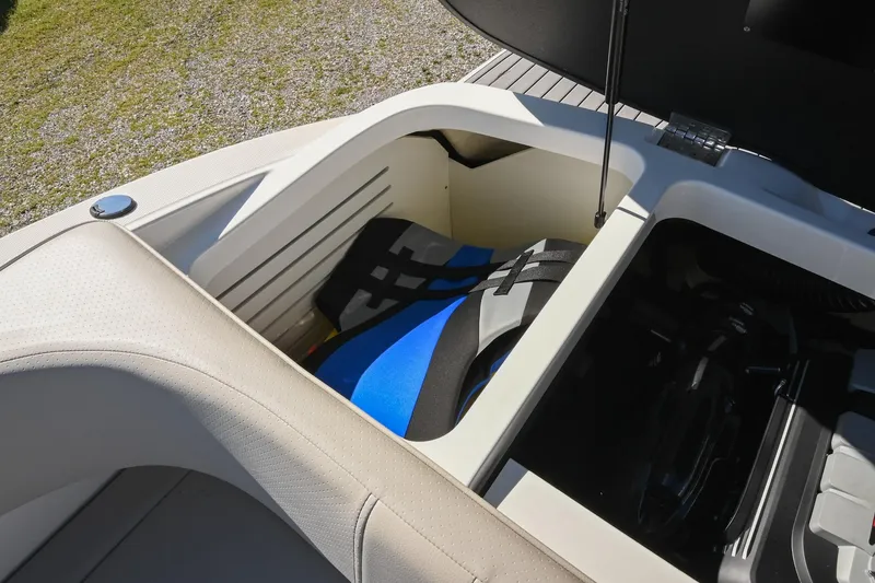 Slide: The Image of Storage compartment in a 2021 Sea Ray SPX 210 boat with life jackets. - 36