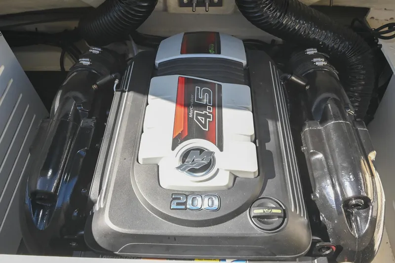 Slide: The Image of 2021 Sea Ray SPX 210 engine, featuring a powerful 4.5L MerCruiser 200 horsepower motor. - 37