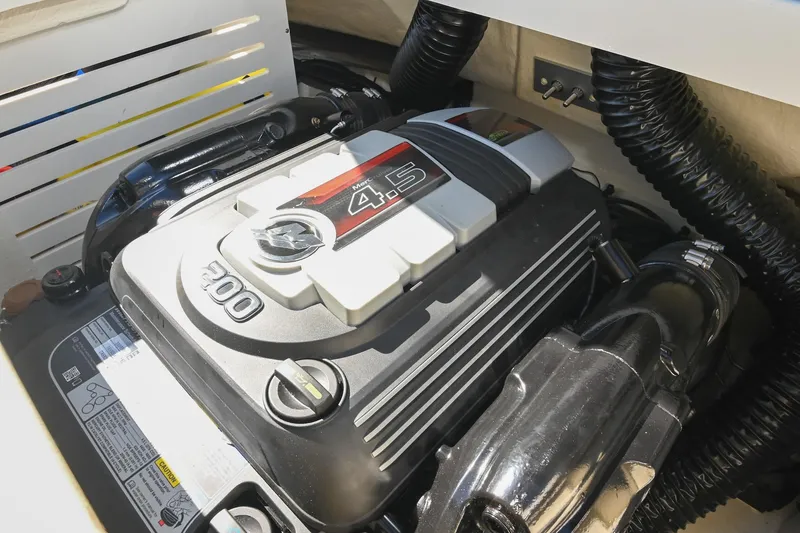 Slide: The Image of Engine compartment of 2021 Sea Ray SPX 210 boat, featuring a 4.5L 200 HP engine. - 38