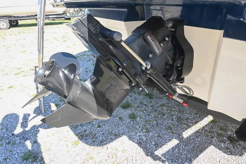 Slide: The Image of Outboard motor of a 2021 Sea Ray SPX 210 boat on gravel surface. - 39
