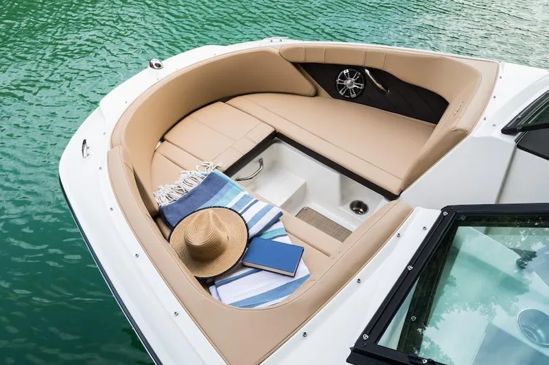 Slide: The Image of 2021 Sea Ray SPX 210 boat on trailer, parked outdoors under sunlight. - 5