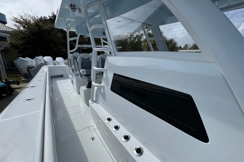 Slide: The Image of 2026 Invincible 46 Catamaran with sleek design and spacious deck layout. - 22