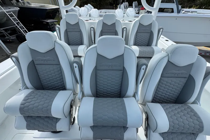 Slide: The Image of Luxury seating on 2026 Invincible 46 Catamaran, featuring gray and white cushioned design. - 26