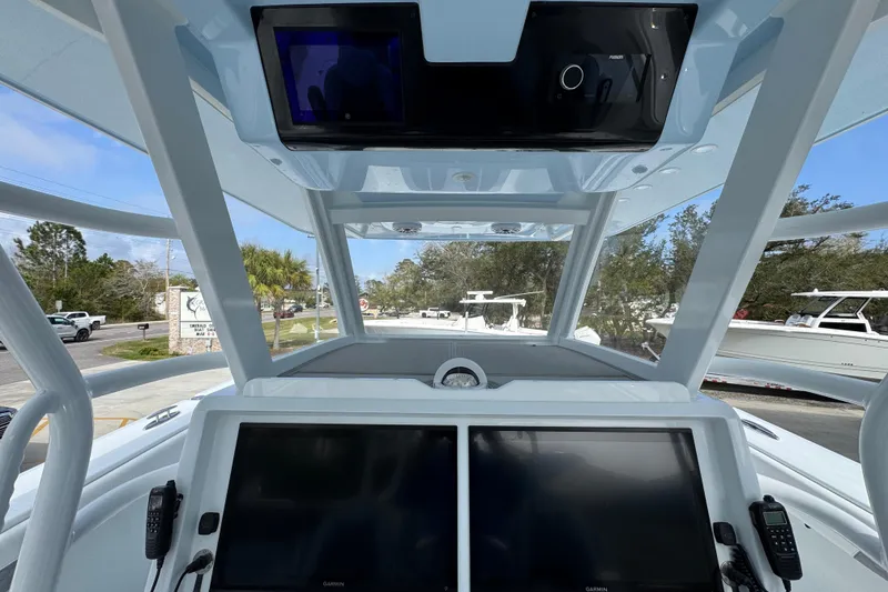 Slide: The Image of 2026 Invincible 46 Catamaran cockpit with dual screens and modern navigation equipment. - 32