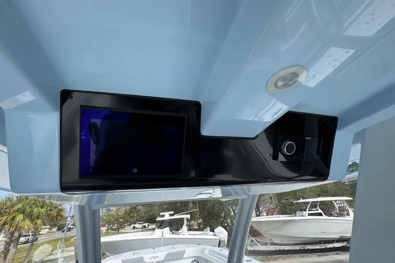 Slide: The Image of 2026 Invincible 46 Catamaran helm with modern navigation display and controls. - 33