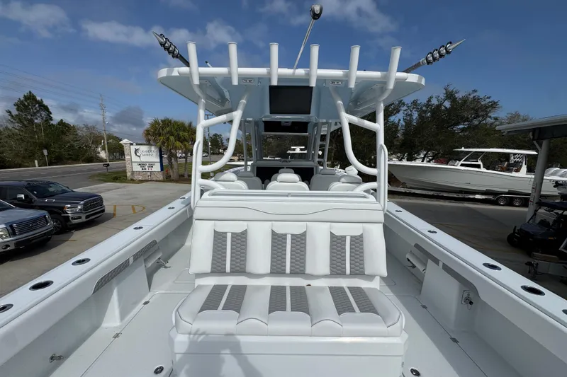 Slide: The Image of 2026 Invincible 46 Catamaran with sleek white seating and modern design. - 36