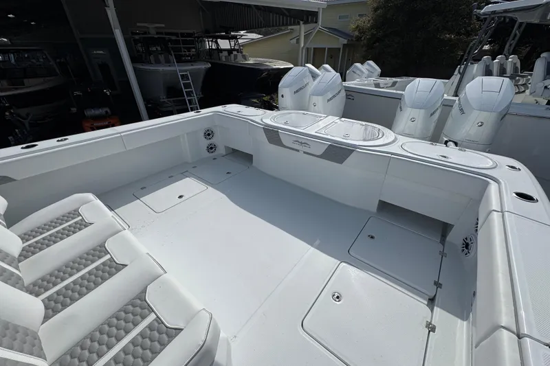 Slide: The Image of 2026 Invincible 46 Catamaran with spacious deck and modern seating in a marina setting. - 39